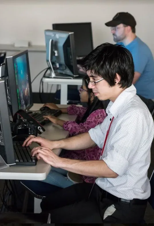 Working one-on-one with a student at the Game Design Summit