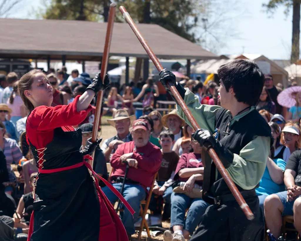 A choreographed polearm fight performed for a festival crowd