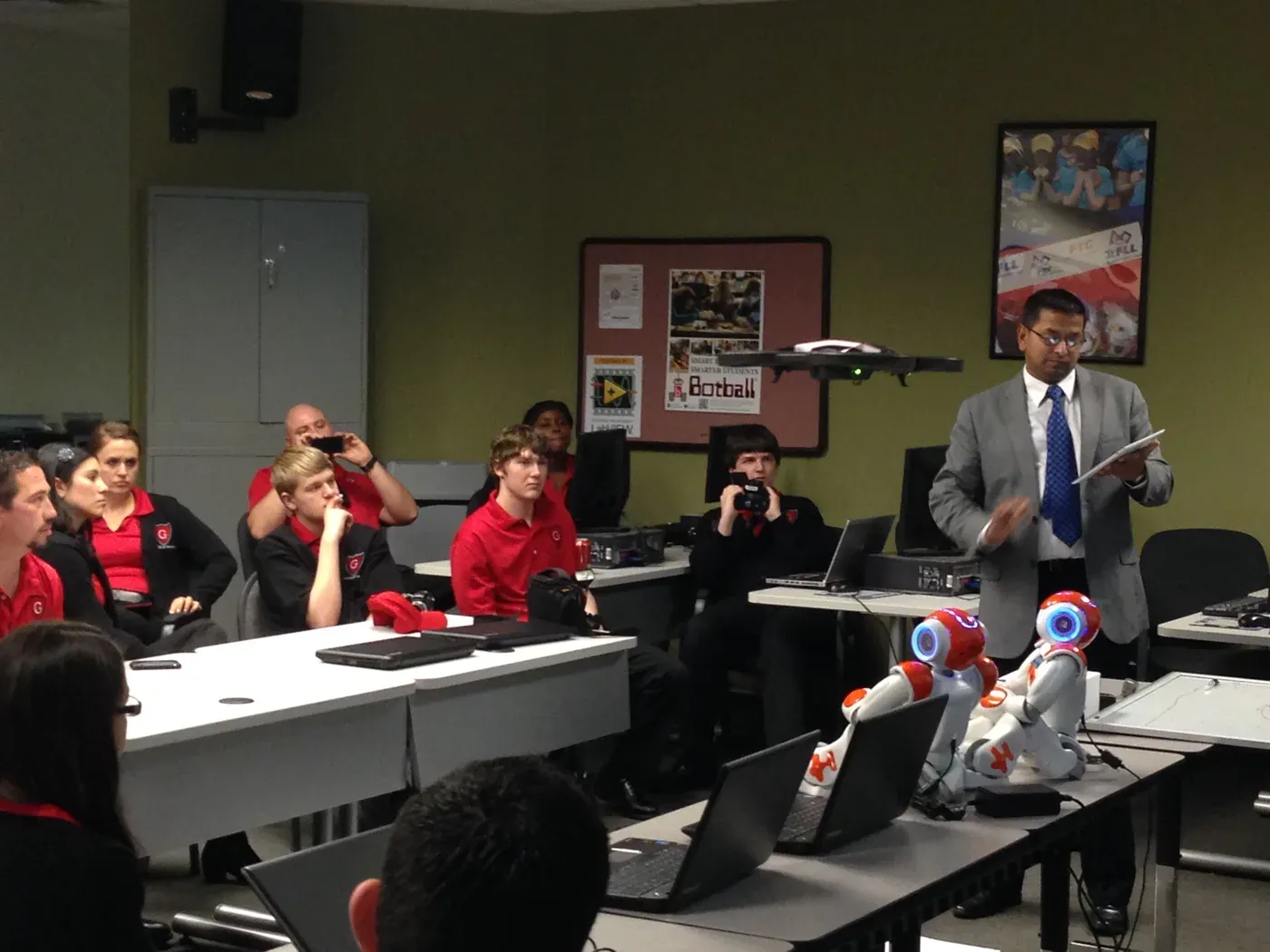 Demonstrating a humanoid robot to a classroom of students